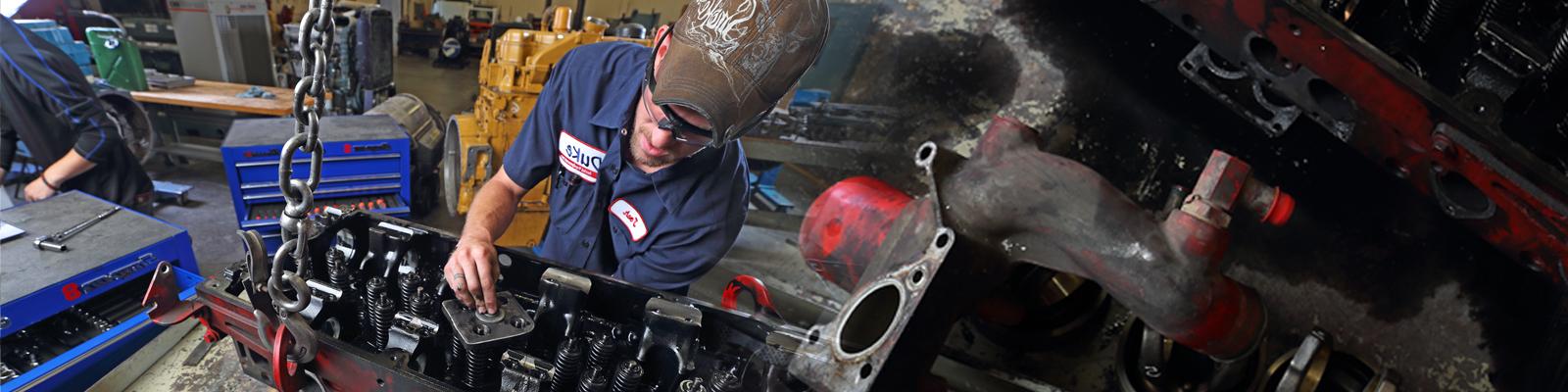 Technician working on a diesel engine